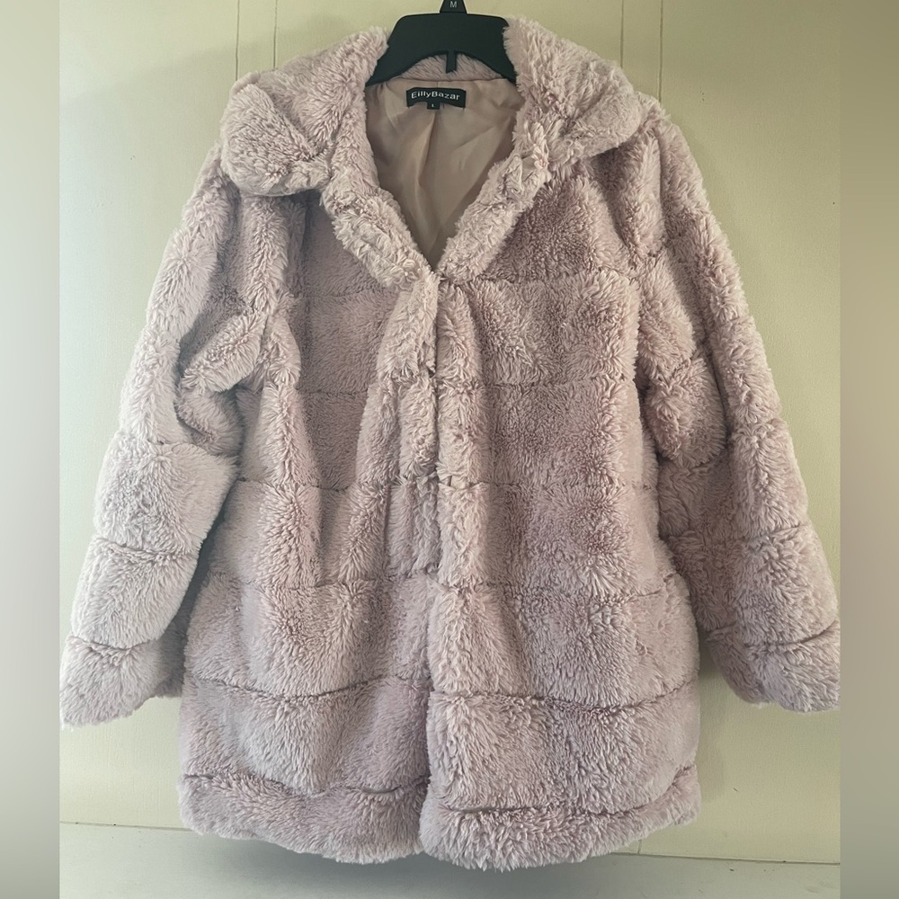 Light pink coat with side pockets , closes in the front